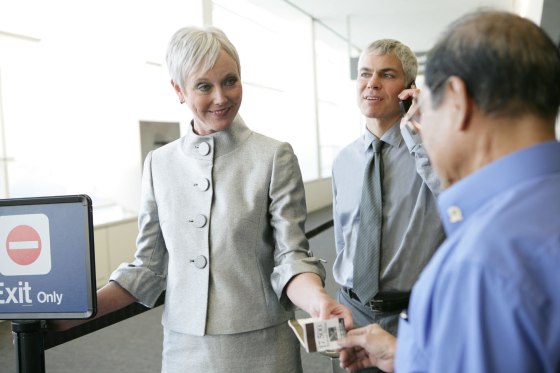 Mature woman showing ticket at airport.. Image shot 2008. Exact date unknown.